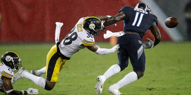 Pittsburgh Steelers defensive back Kam Kelly (38) forces a fumble by Tennessee Titans wide receiver A.J. Brown (11) in the first half of a preseason NFL football game Sunday, Aug. 25, 2019, in Nashville, Tenn. Brown recovered the ball on the play. (AP Photo/James Kenney)