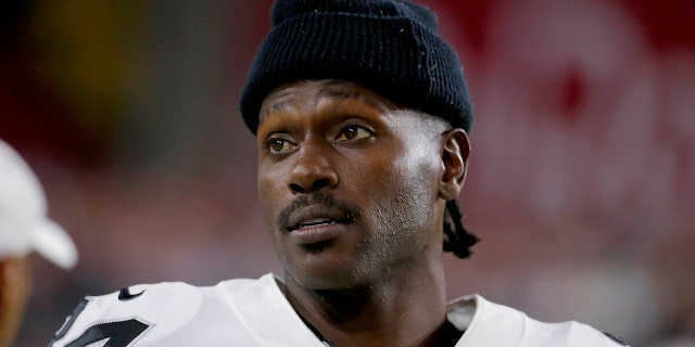 Oakland Raiders wide receiver Antonio Brown watches from the sidelines during the second half of the team's NFL preseason football game against the Arizona Cardinals in Glendale, Ariz. (AP Photo/Rick Scuteri, File)