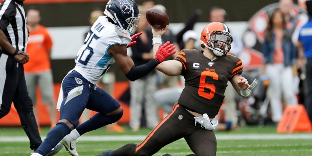 Cleveland Browns quarterback Baker Mayfield (6) throws under pressure from Tennessee Titans cornerback Logan Ryan (26) during the first half in an NFL football game, Sunday, Sept. 8, 2019, in Cleveland. (AP Photo/Ron Schwane)