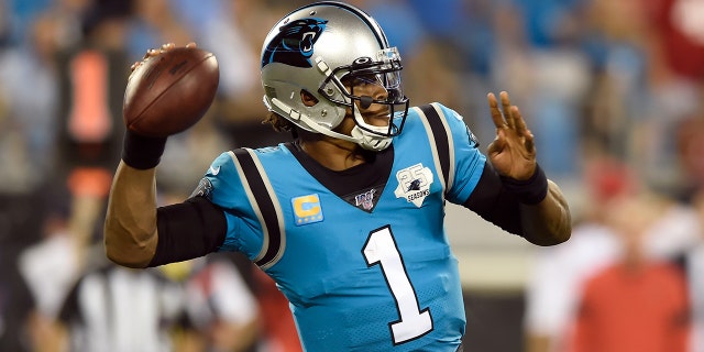 Carolina Panthers quarterback Cam Newton (1) passes against the Tampa Bay Buccaneers during the second half of an NFL football game in Charlotte, N.C., Thursday, Sept. 12, 2019. (AP Photo/Mike McCarn)