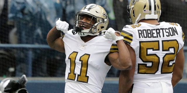 New Orleans Saints' Deonte Harris (11) celebrates his touchdown on a punt return against the Seattle Seahawks during the first half of an NFL football game Sunday, Sept. 22, 2019, in Seattle. (AP Photo/Ted S. Warren)