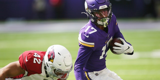 Minnesota Vikings wide receiver Dillon Mitchell (17) runs from Arizona Cardinals safety Jonathan Owens after making a reception during the second half of an NFL preseason football game, Saturday, Aug. 24, 2019, in Minneapolis. (AP Photo/Jim Mone)