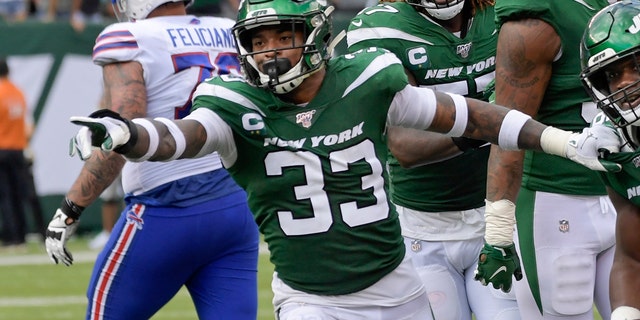 New York Jets' Neville Hewitt (46) and Jamal Adams (33) celebrate with teammates after Neville Hewitt intercepted a pass during the first half of an NFL football game against the Buffalo Bills Sunday, Sept. 8, 2019, in East Rutherford, N.J. (AP Photo/Bill Kostroun)