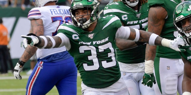 New York Jets' Neville Hewitt (46) and Jamal Adams (33) celebrate with teammates after Neville Hewitt intercepted a pass during the first half of an NFL football game against the Buffalo Bills Sunday, Sept. 8, 2019, in East Rutherford, N.J. (AP Photo/Bill Kostroun)