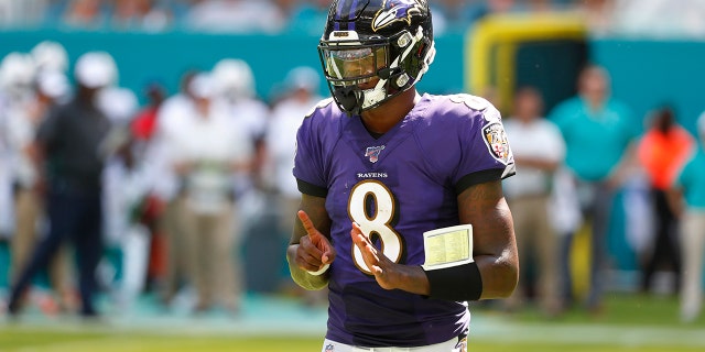 Baltimore Ravens quarterback Lamar Jackson (8), gestures, during the second half at an NFL football game against the Miami Dolphins, Sunday, Sept. 8, 2019, in Miami Gardens, Fla. (AP Photo/Wilfredo Lee)