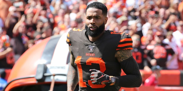 Cleveland Browns wide receiver Odell Beckham Jr. is introduced as he runs out on the field before an NFL football game against the Tennessee Titans, in Cleveland, on Sept. 8, 2019. (AP Photo/Ron Schwane, File)