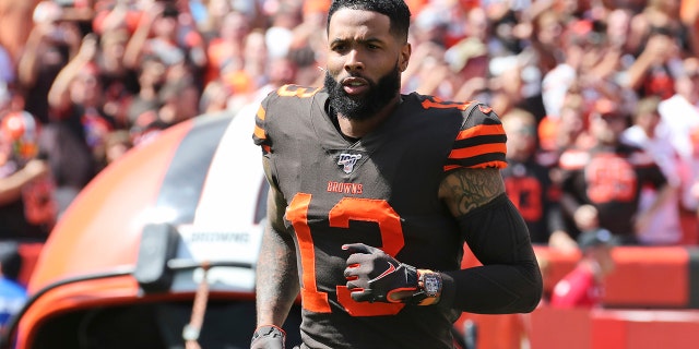 Cleveland Browns wide receiver Odell Beckham Jr. is introduced as he runs out on the field before an NFL football game against the Tennessee Titans, in Cleveland, on Sept. 8, 2019. (AP Photo/Ron Schwane, File)