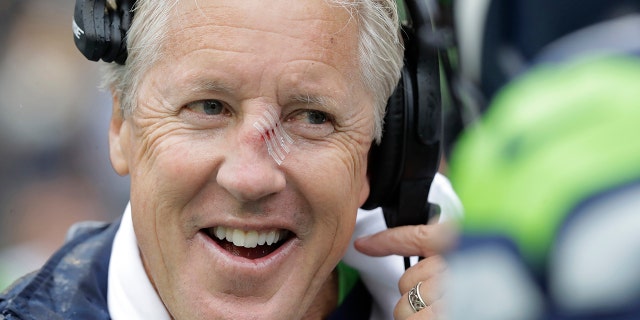 Seattle Seahawks head coach Pete Carroll sports tape on his nose before an NFL football game against the New Orleans Saints, Sunday, Sept. 22, 2019, in Seattle. (AP Photo/Ted S. Warren)