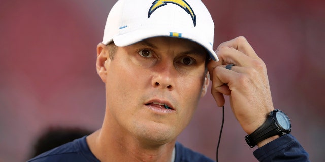 Los Angeles Chargers quarterback Philip Rivers runs Thursday, Aug. 29, 2019, in Santa Clara, Calif. in watches from the sideline during the first half of the Chargers' NFL preseason football game against the San Francisco 49ers.