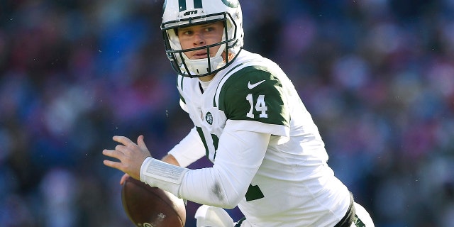 In this Dec. 9, 2018, file photo, New York Jets quarterback Sam Darnold rolls out during the first half of an NFL football game against the Buffalo Bills, in Orchard Park, N.Y. (AP Photo/Adrian Kraus, File)