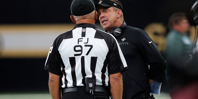 New Orleans Saints head coach Sean Payton talks to an official during the first half of the team's NFL preseason football game against the Miami Dolphins in New Orleans, Thursday, Aug. 29, 2019. (AP Photo/Bill Feig)