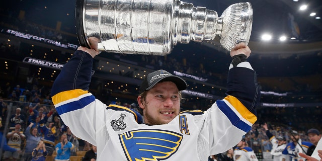 In this June 12, 2019, file photo, St. Louis Blues' Vladimir Tarasenko, of Russia, carries the Stanley Cup after the team defeated the Boston Bruins in Game 7 of the NHL Stanley Cup Final in Boston. Tarasenko is thankful for the internet because it allows his grandfather back home in Russia to watch NHL games. Starting this season, Tarasenko’s grandfather and the rest of Russia will be able to watch every single regular-season and playoff game. The NHL is expanding its reach into Russia with a new streaming agreement with Yandex that will more than triple the amount of games broadcast there. (AP Photo/Michael Dwyer, File)