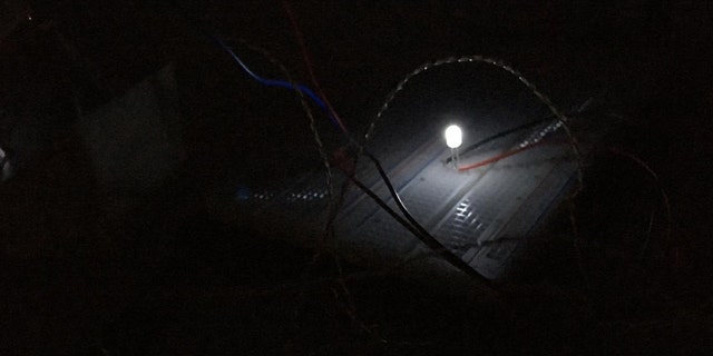In this photograph, the thermoelectric generator harnesses temperature differences to produce renewable electricity without active heat input. Here it is generating light. (Credit: Aaswath Raman)