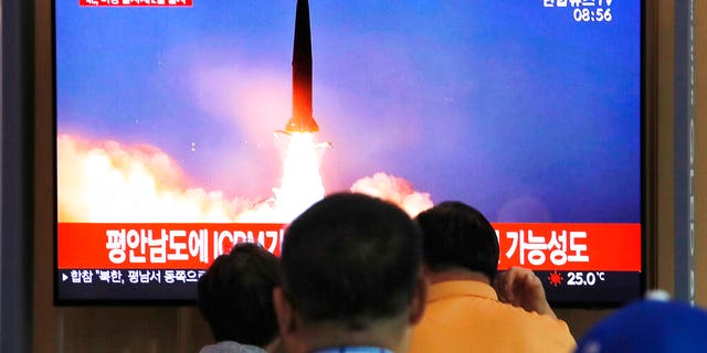 People watch a TV showing a file image of a North Korea's missile launch during a news program at the Seoul Railway Station in Seoul, South Korea, Tuesday, Sept. 10, 2019. (AP Photo/Ahn Young-joon)