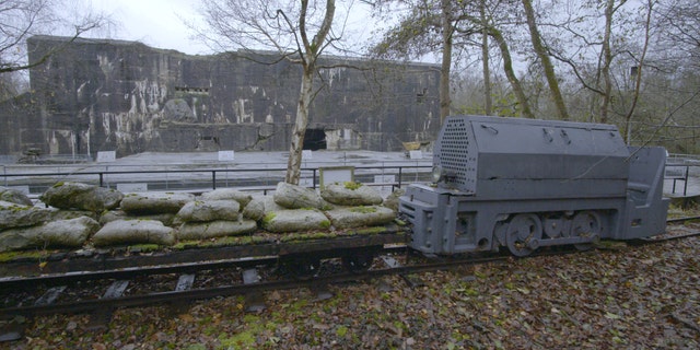 A train is shown outside the Blockhaus at the Nazi base Kraftwerk Nord West in northern France. (Science Channel)