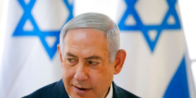 Israeli Prime Minister Benjamin Netanyahu chairs during the weekly cabinet meeting being held in the Jordan Valley, in the Israeli-occupied West Bank, Sunday, Sept. 15, 2019. (Amir Cohen/Pool via AP)
