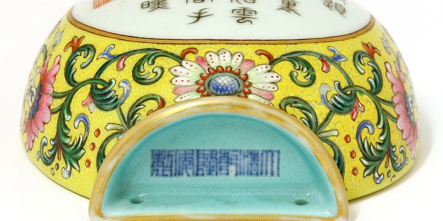 The 8ins Qianlong famille rose vase, found in Hertfordshire, was made around 300 years ago in China and was marked with a symbol that meant it wasn't for export, but for the Emperor's palace. (Credit: Sworders, BNPS)
