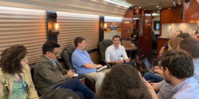 Pete Buttigieg talks with reporters during his four-day bus tour throughout eastern Iowa. (Mitti Hicks/Fox News)