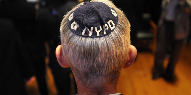 UNITED STATES - SEPTEMBER 16: New York City Police Department holds annual High Holy Days meeting where stolen Torahs from the Jewish Center of Kew Gardens Hills were returned to the congregation - Chief NYPD Chaplain Rabbi Alvin Kass was on hand for the ceremony (Photo by Susan Watts/NY Daily News Archive via Getty Images)