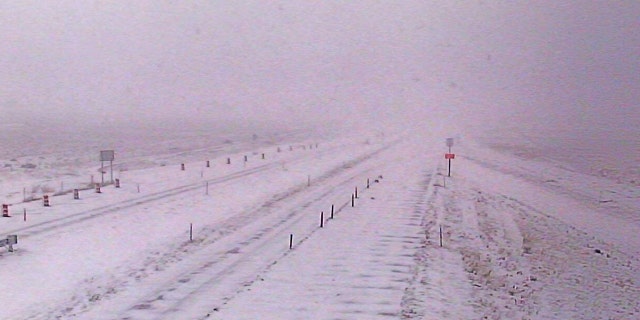 Whiteout conditions can be seen on Interstate 15 near Sieben, Mont. on Sunday as an early-season winter storm impacts the region.