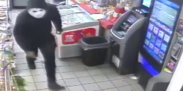 Philadelphia police were looking for a man seen on surveillance video attacking a gas station worker with a hammer during a robbery, investigators said.