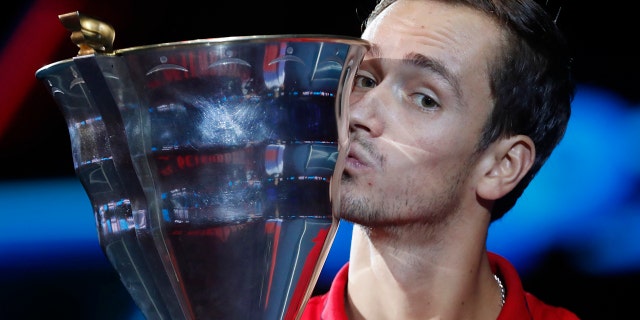 Daniil Medvedev of Russia kisses the trophy after winning the St. Petersburg Open ATP tennis tournament final match against Borna Coric of Croatia in St.Petersburg, Russia, Sunday, Sept. 22, 2019. (AP Photo/Elena Ignatyeva)