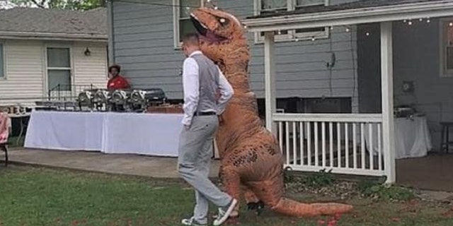 One confident maid of honor rocked an inflatable T-Rex costume to her sister’s recent wedding.