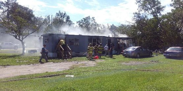 The mobile home was set ablaze Friday afternoon, according to police.