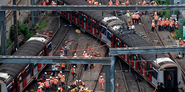 The train derailment in Hong Kong injured at least eight people. (REUTERS/Tyrone Siu)