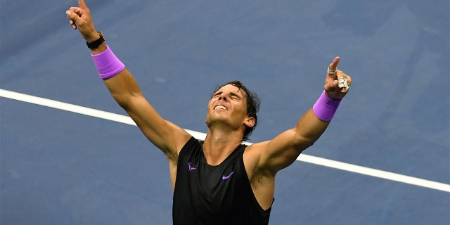 Rafael Nadal celebrating after he beat Daniil Medvedev in five sets.