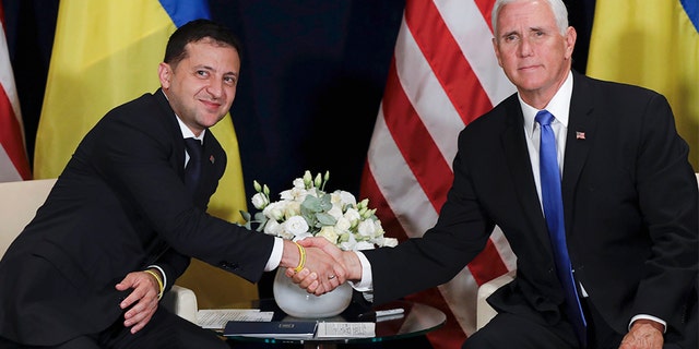 Pelosi announces formal impeachment inquiry against Trump 3 Ukraine's President Volodymyr Zelenskiy, left, shakes hands with U.S. Vice President Mike Pence, in Warsaw, Poland, Sunday, Sept. 1, 2019. (AP Photo/Petr David Josek)