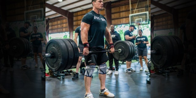 This summer, WWE star John Cena explained that happiness for a man isn’t always about the machismo element associated with being an “alpha-male,” but the connection he may have to a group of people with a common goal. (FitOps Foundation)
