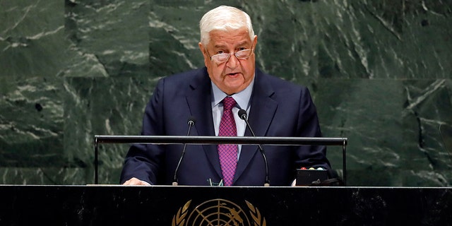FILE - Syria's Deputy Prime Minister Walid Al-Moualem addresses the 74th session of the United Nations General Assembly, Saturday, Sept. 28, 2019. (AP Photo/Richard Drew)