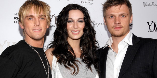 Aaron Carter stands with his siblings, Angel Carter and Nick Carter. Aaron, 32, has sparked debate with siblings over social media in recent months. In September, Nick, 39, requested a restraining order against the "Aaron's Party" singer, which was granted.