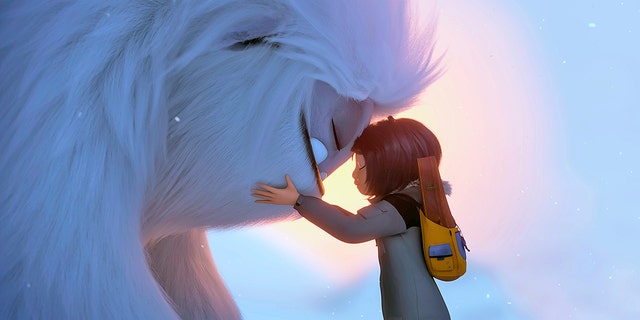 This image released by DreamWorks Animation shows Everest the Yeti, left, and Yi, voiced by Chloe Bennet, in a scene from "Abominable," in theaters on Sept. 27.