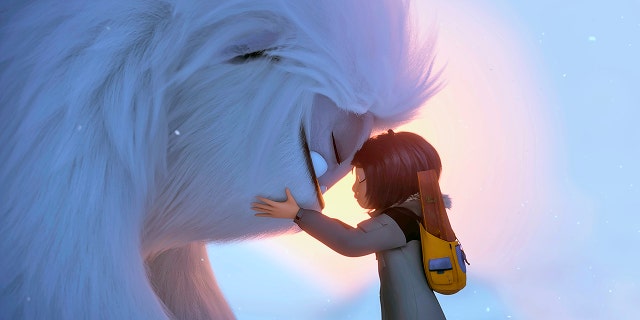 This image released by DreamWorks Animation shows Everest the Yeti, left, and Yi, voiced by Chloe Bennet, in a scene from "Abominable," in theaters on Sept. 27.