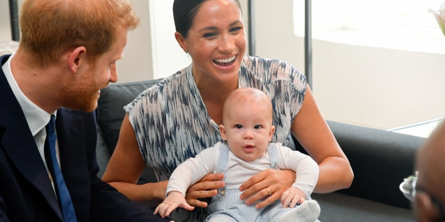 (L-R) Prince Harry, Duke of Sussex, Meghan, Duchess of Sussex, and their baby son Archie Mountbatten-Windsor in September 2019.