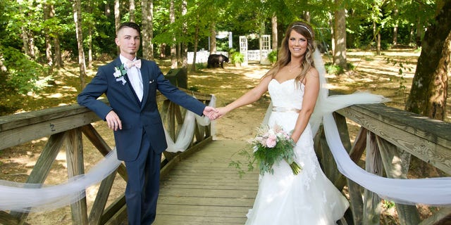 The bear eventually left on its own, but the bride and groom managed to get some impressive shots out of the surprising scene.
