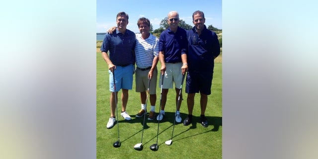 Devon Archer, far left, with former Vice President Joe Biden and his son Hunter, far right, in 2014.