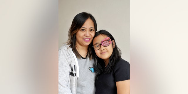 Kirsten Fajardo and her mom Liza (left).