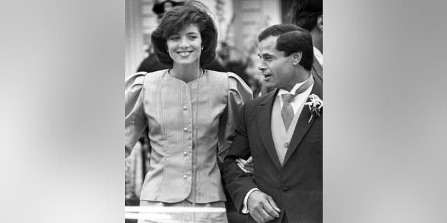 In this April 26, 1986, file photo, maid of Honor Caroline Kennedy and Best Man Franco Columbu leave St. Francis Xavier Church after the wedding of Caroline's cousin Maria Shriver to Arnold Schwarzenegger in Hyannis, Mass. Italian bodybuilder, boxer and actor Franco Columbu, one of Arnold Schwarzenegger's closest friends, has died aged 78. Columbu died in a hospital in his native Sardinia on Friday, Aug. 30, 2019 afternoon after being taken ill while he was swimming in the sea.