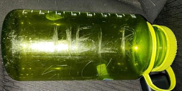 Working with what he had, the dad carved “HELP!” twice onto his lime-green Nalgene bottle and tucked a dated SOS note inside. 