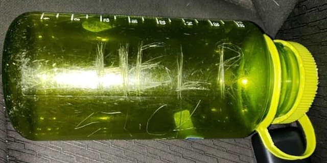 Working with what he had, the dad carved “HELP!” twice onto his lime-green Nalgene bottle and tucked a dated SOS note inside.