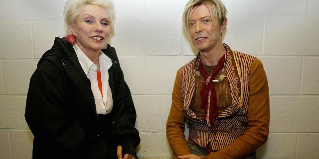 Debbie Harry chats with David Bowie before his concert as part of The Reality Tour at Manchester Evening News Arena in Manchester, England, on Nov. 17, 2003.
