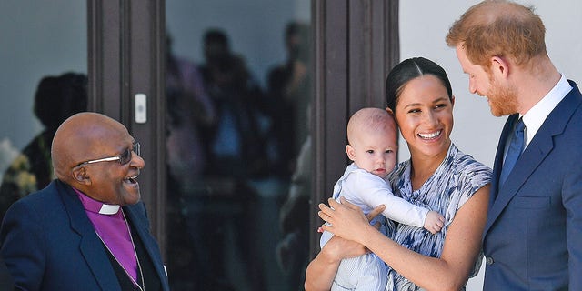 The Duke and Duchess of Sussex of Britain, Prince Harry and his wife Meghan Markle hold their grandson Archie as they meet Archbishop Desmond Tutu at the Tutu Legacy Foundation in Cape Town on September 25th. 2019. The British royal couple take a day trip to southern Africa - their first official family visit since the birth of their son Archie in May.