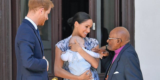 Prince Harry, Duke of Sussex, Meghan, Duchess of Sussex and their baby son Archie Mountbatten-Windsor meet Archbishop Desmond Tutu at the Desmond & Leah Tutu Legacy Foundation during their royal tour of South Africa. (Photo by Pool/Samir Hussein/WireImage)
