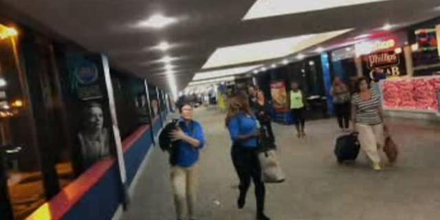 Passengers in Terminal A were forced to evacuate after an Alaska Airlines employee reportedly yelled "evacuate" and sounded an alarm after believing two men were acting suspiciously.