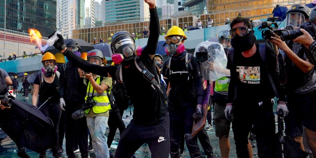 Hong Kong police deploy water cannons amid clashes with protesters in ...