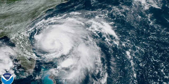 Tropical Storm Humberto can be seen swirling just north of the northwestern Bahamas and off the coast of Florida on Sunday.