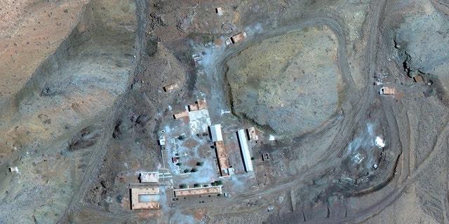 A March 27 satellite image of the Iranian site provided by Maxar Technologies shows a compound with a series of buildings surrounding a courtyard, with other smaller structures away from it.